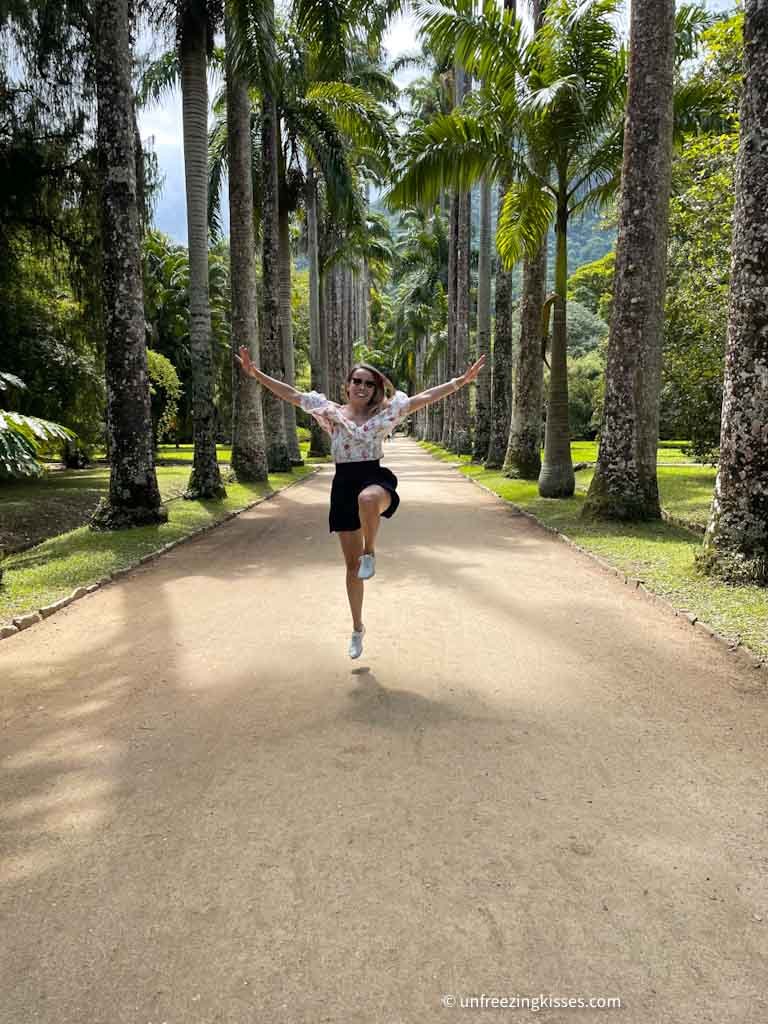 Woman jumping in Jardim Botanico in Rio de Janeiro, Brazil